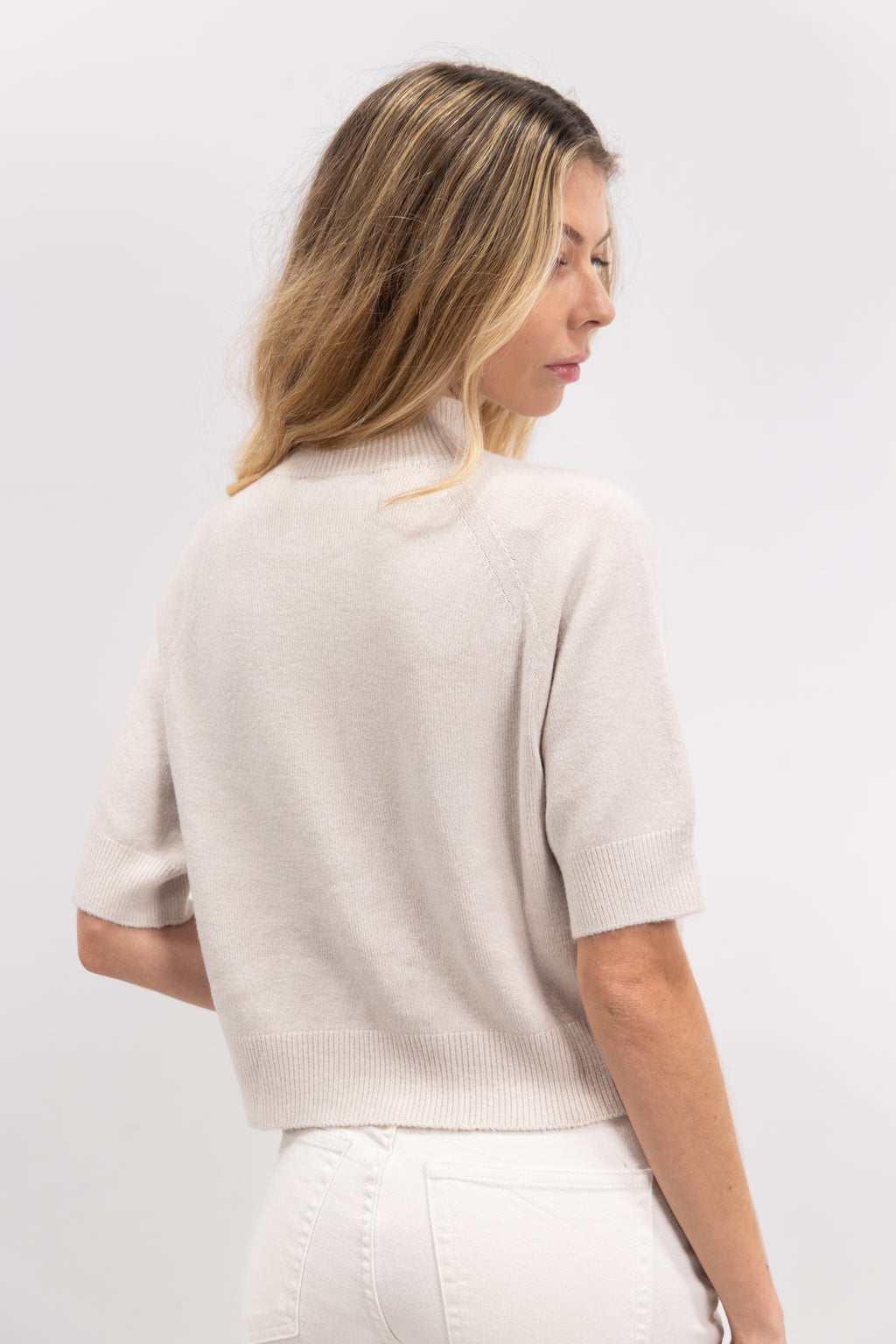 Short-sleeved cropped sweater with high neck